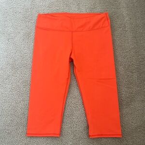 Fabletics orange leggings. Size M.